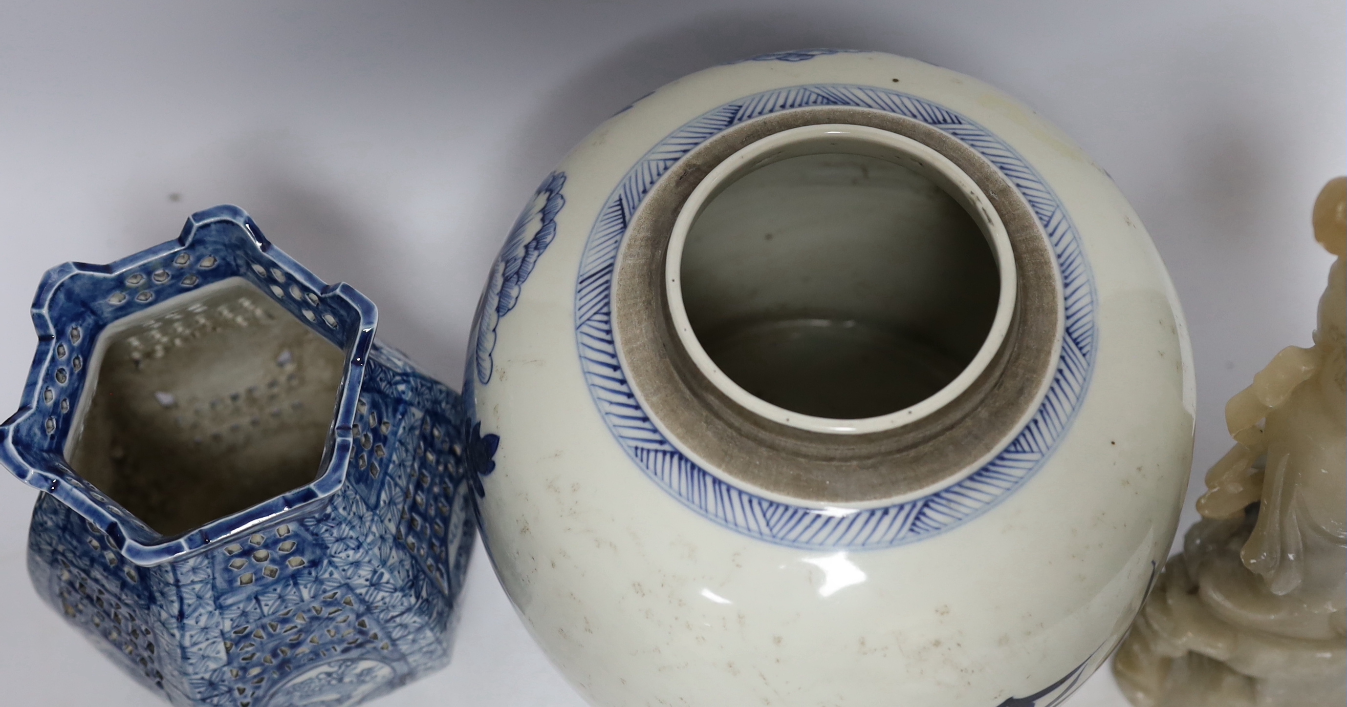 A Chinese blue and white jar and a soapstone figure, 31cm high